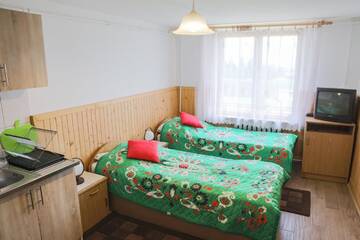 Фото номера Шале с одной спальней Фермерские дома GAZDÓWKA POD JABŁONKAMI г. Новы-Тарг 5